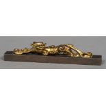 A Chinese carved giltwood model of a dragon,