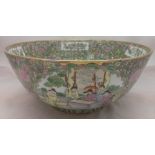 A Chinese porcelain punch bowl Decorated with figural vignettes on a floral ground,