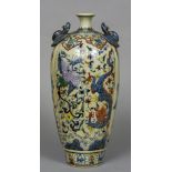 A Chinese porcelain twin handled vase Decorated with mythical beasts amongst lotus strapwork,