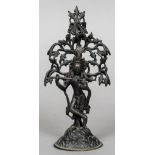 A patinated bronze model of Buddha Formed playing a flute beneath a tree. 22.5 cm high.
