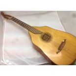 A German lute guitar Of typical construction. 102 cm long.