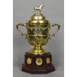 An Edwardian silver gilt twin handled trophy cup, hallmarked London 1901,
