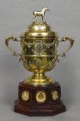 An Edwardian silver gilt twin handled trophy cup, hallmarked London 1901,