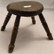 A 19th century miniature elm topped stool