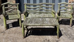 A rustic log four piece garden set