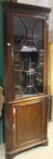 A 19th century mahogany glazed corner cabinet