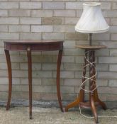 A lamp table and a modern demi-lune table