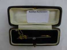 A 9 ct gold and diamond bar brooch