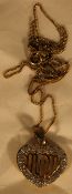 A pendant inscribed Mum,