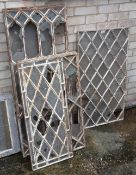 A quantity of cast iron window frames and two stained glass windows