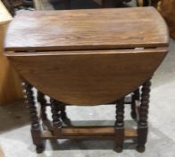 An oak bobbin twist gate-leg table