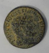 A struck coin with Roman head,