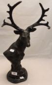 A bronze stag bust on marble base