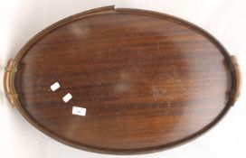 A mahogany oval tray