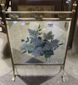 A painted brass framed fire screen