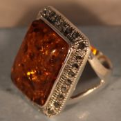 A silver and marcasite dress ring