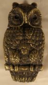 A brass owl form vesta