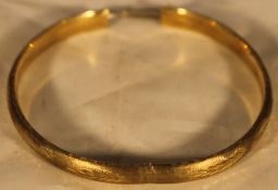 A 9 ct gold bangle form bracelet