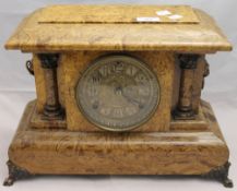 A simulated marble wooden mantle clock