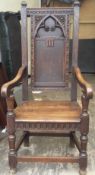 A 19th century oak panel back armchair