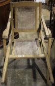 A 19th century folding cane invalid chair