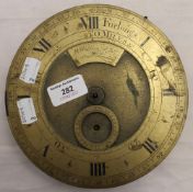 A brass clock dial,