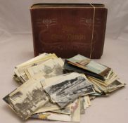 A vintage album of early 1900-1920s miscellaneous postcards and a small box of mixed vintage