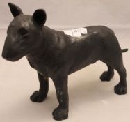 A bronze of a dog with a pointy nose