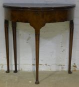 An 18th century style demi-lune card table