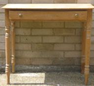 A Victorian pine bow front side table