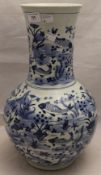 A Chinese blue and white porcelain vase decorated with fish