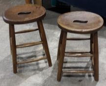 A pair of elm seated stools