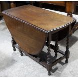 An oak barley twist gate leg table