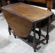 An oak barley twist gate leg table