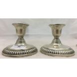 A pair of silver candlesticks