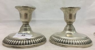 A pair of silver candlesticks