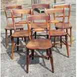 Six Victorian elm seated knife back chairs