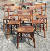 Six Victorian elm seated knife back chairs