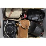 A box of various cameras