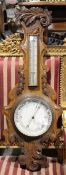 A Victorian carved oak wheel barometer