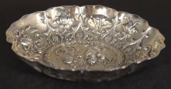 A silver embossed bon bon dish