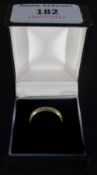 A 9 ct gold half eternity ring