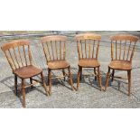 A set of four Victorian stick back chairs