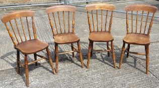 A set of four Victorian stick back chairs