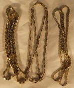 Three silver gilt necklaces