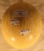 An ostrich egg carved with Egyptian scene