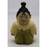 A small carved wooden Oriental figure