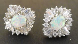 A pair of silver and opal earrings