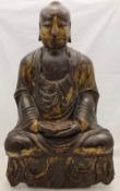 A large painted carved wooden Ming Buddha