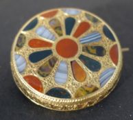 A yellow metal and hardstone brooch